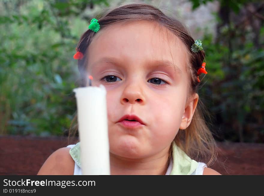 Little girl who has just blown the candle fire out. Little girl who has just blown the candle fire out