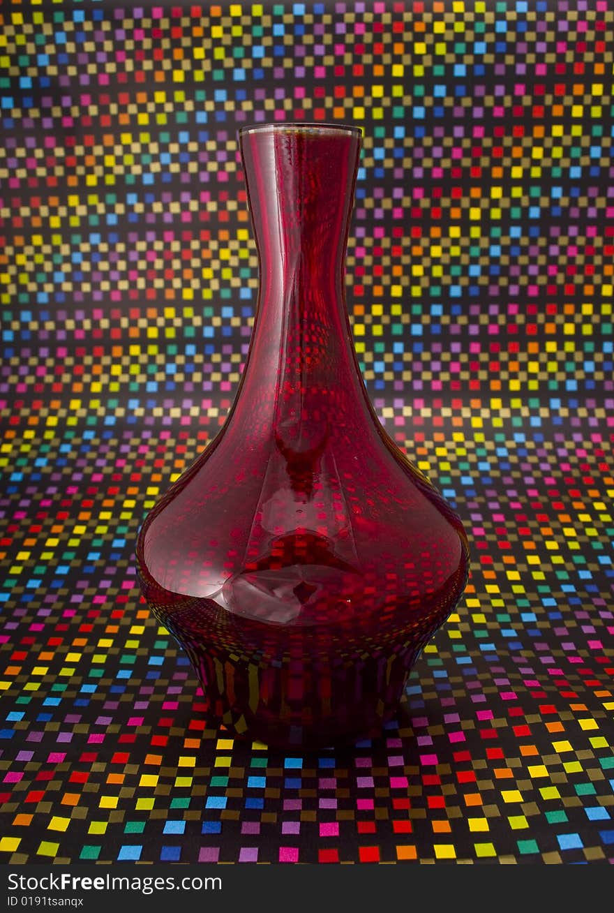 Red vase close-up isolated on colorful background