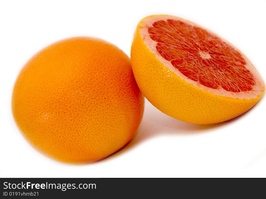 Citrus Fruits - pink half sliced grapefruit. Citrus Fruits - pink half sliced grapefruit