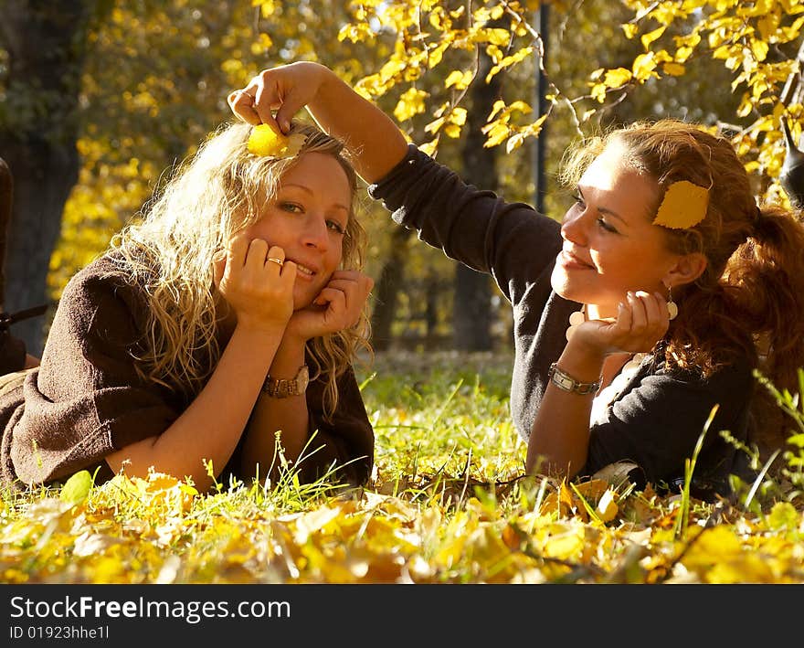 Two beautiful girl in autumn