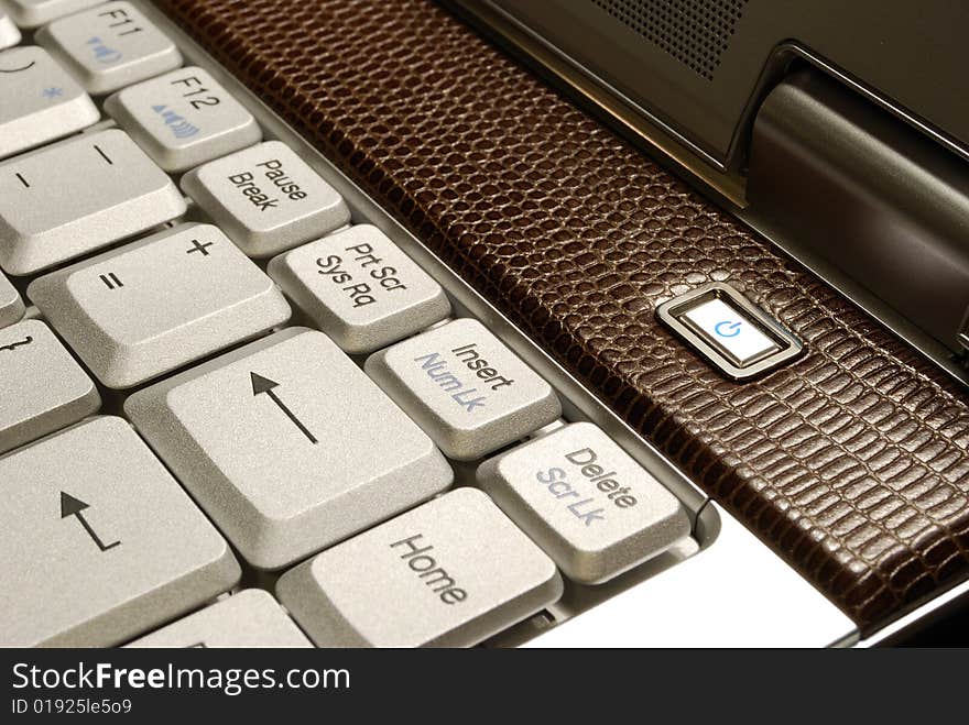 Brown leather laptop and its keyboard