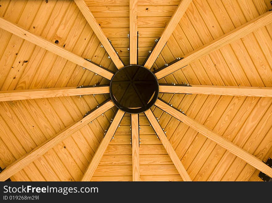 A circular roof made of wood and iron. A circular roof made of wood and iron