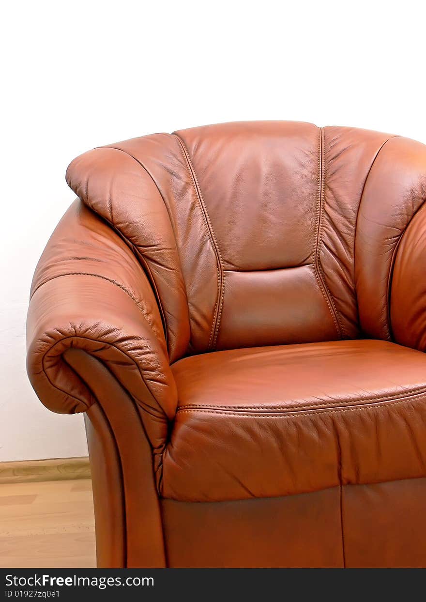 Fragment of comfortable brown leather armchair. Fragment of comfortable brown leather armchair.