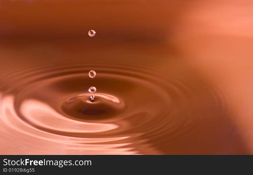 Water droplets close up in orange. Water droplets close up in orange