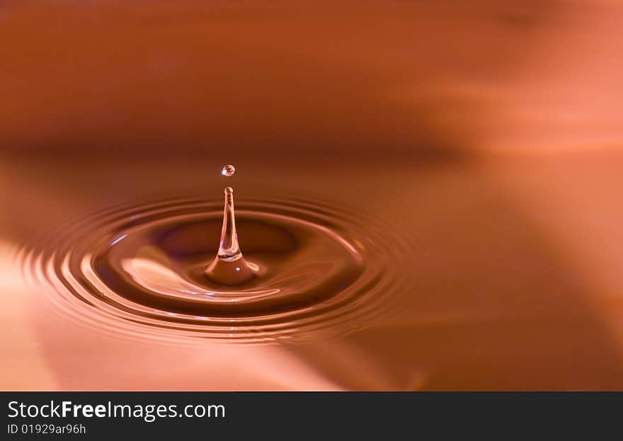 Water droplets close up in orange. Water droplets close up in orange