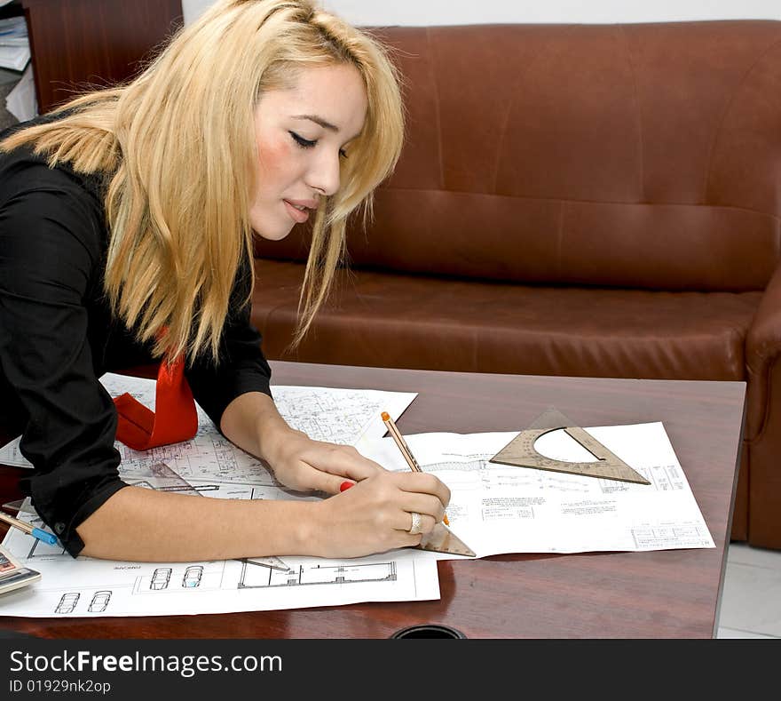 Beautiful architect designing in her office