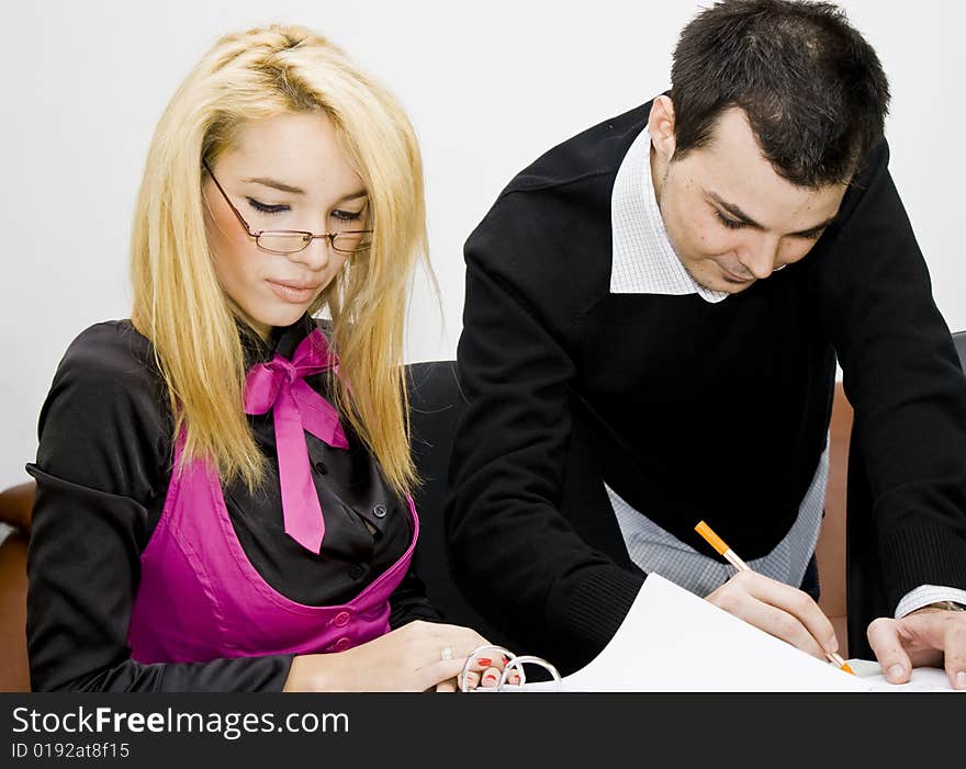 Successful business team working over a laptop computer and documents