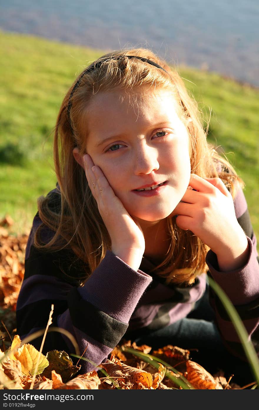 Autumn girl in grass