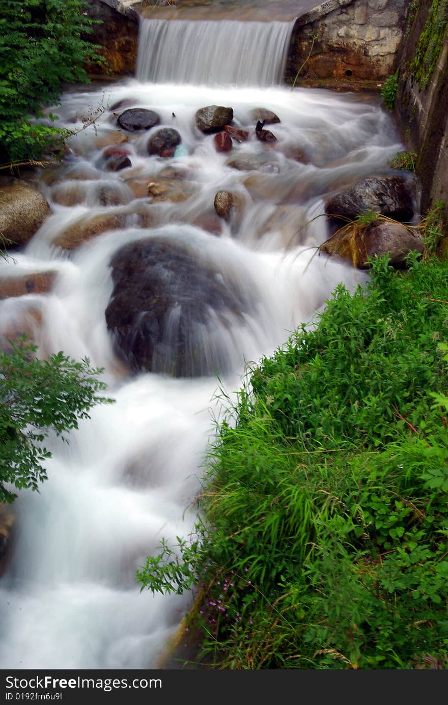 Silky water in a torrent in the Italian Alps. Silky water in a torrent in the Italian Alps.