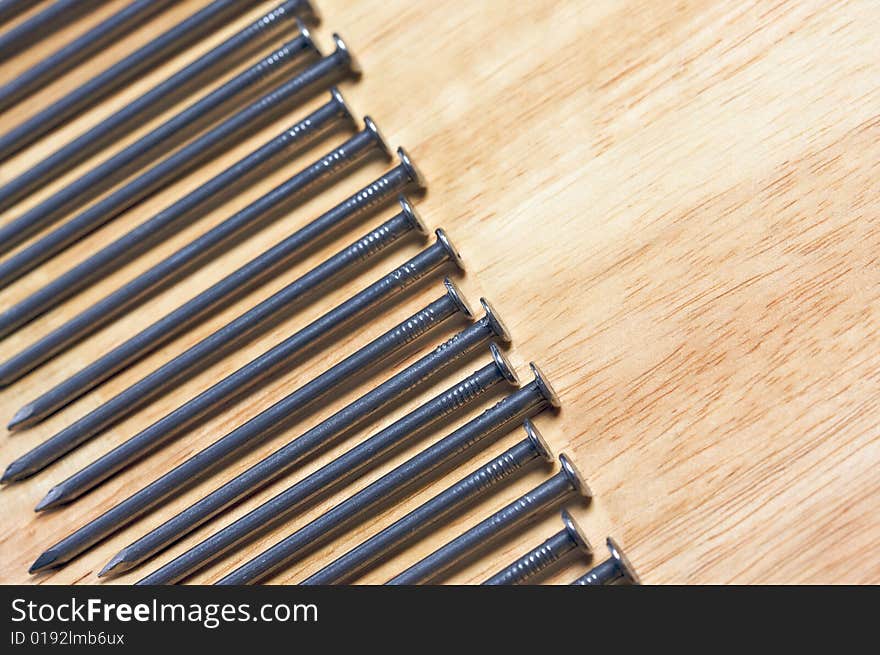 Macro of Nails on a Wood Background. Macro of Nails on a Wood Background.