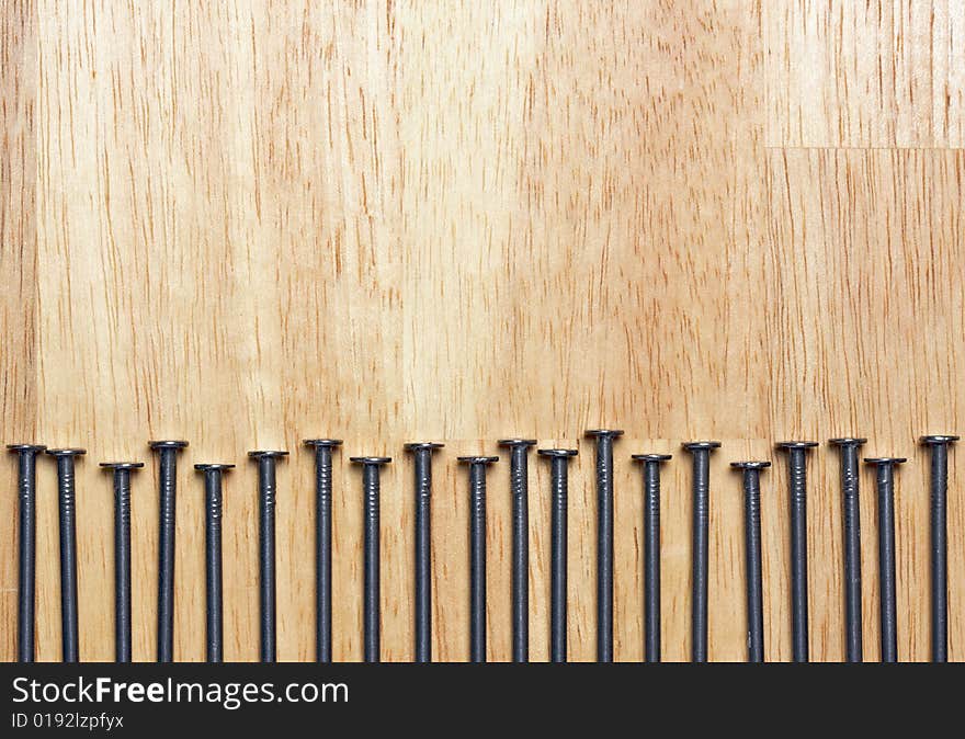 Macro of Nails on a Wood Background. Macro of Nails on a Wood Background.