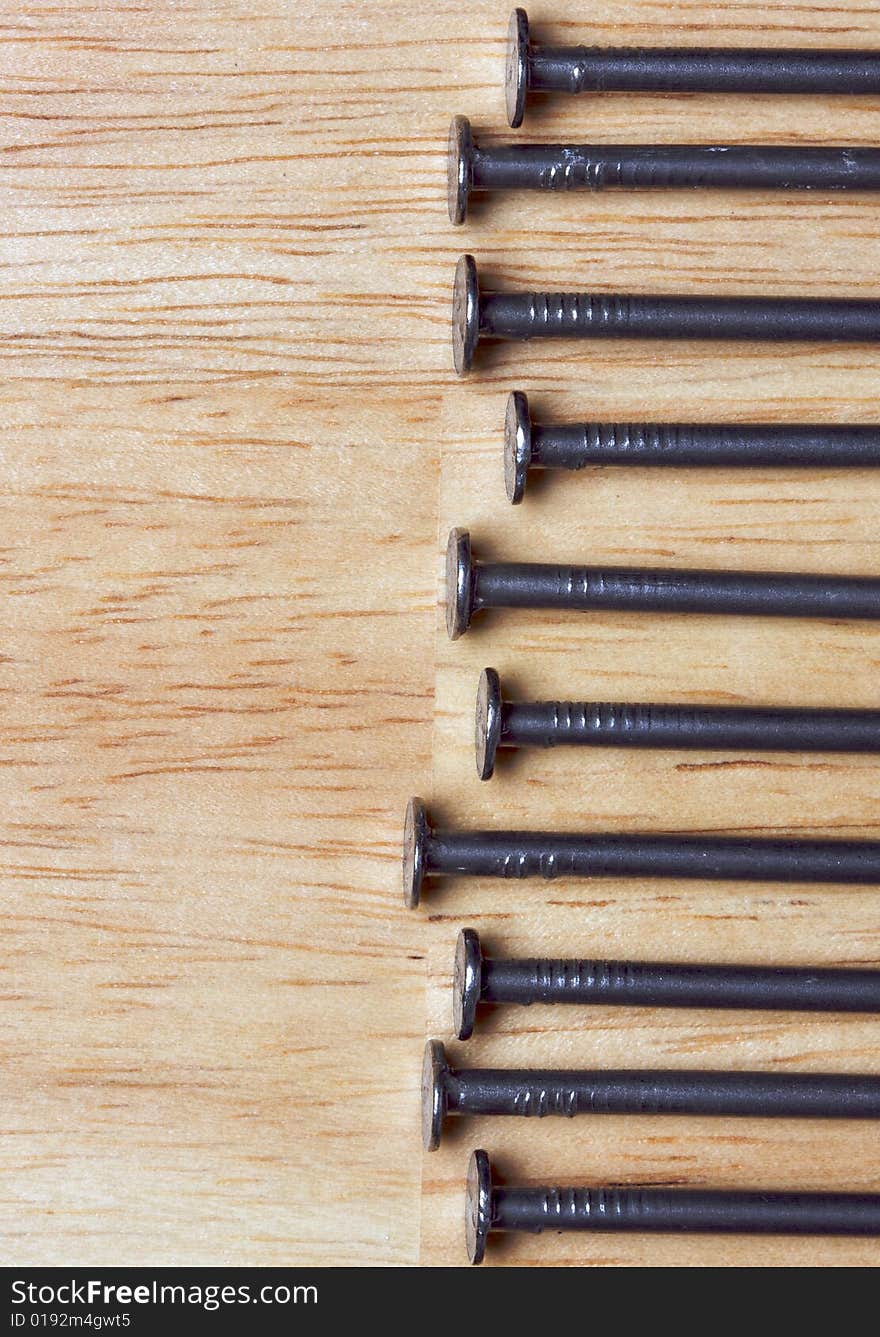 Macro of Nails on a Wood Background. Macro of Nails on a Wood Background.