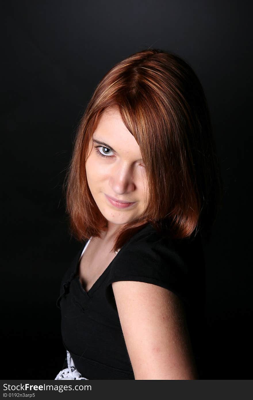 Pretty teenage girl with red hair and black shirt