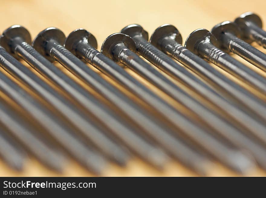 Macro of Nails on a Wood Background. Macro of Nails on a Wood Background.