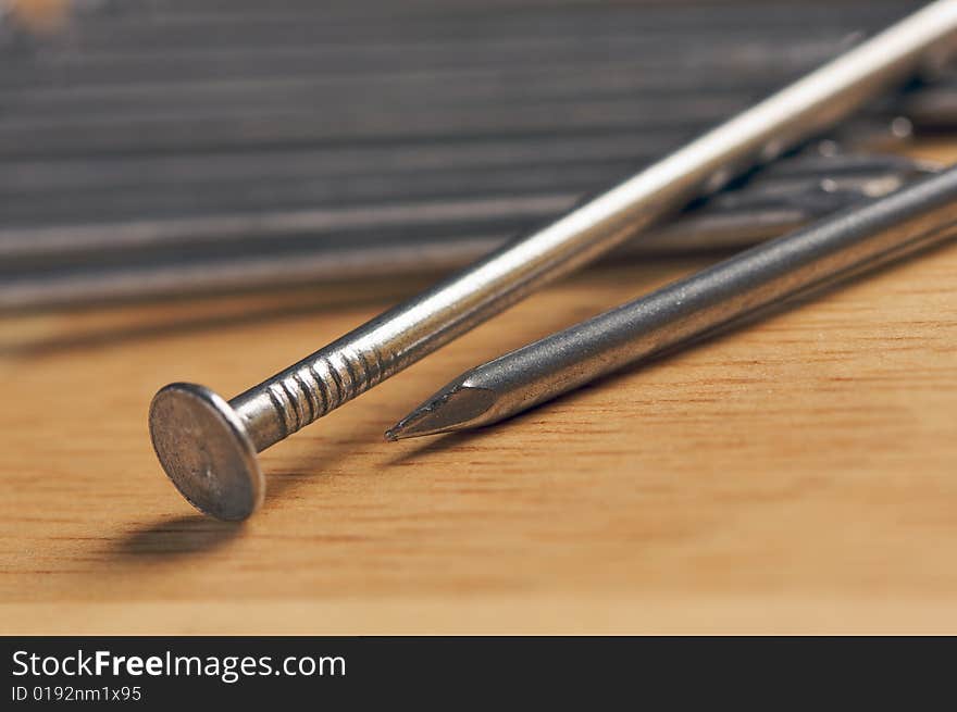 Macro of Nails on a Wood Background. Macro of Nails on a Wood Background.