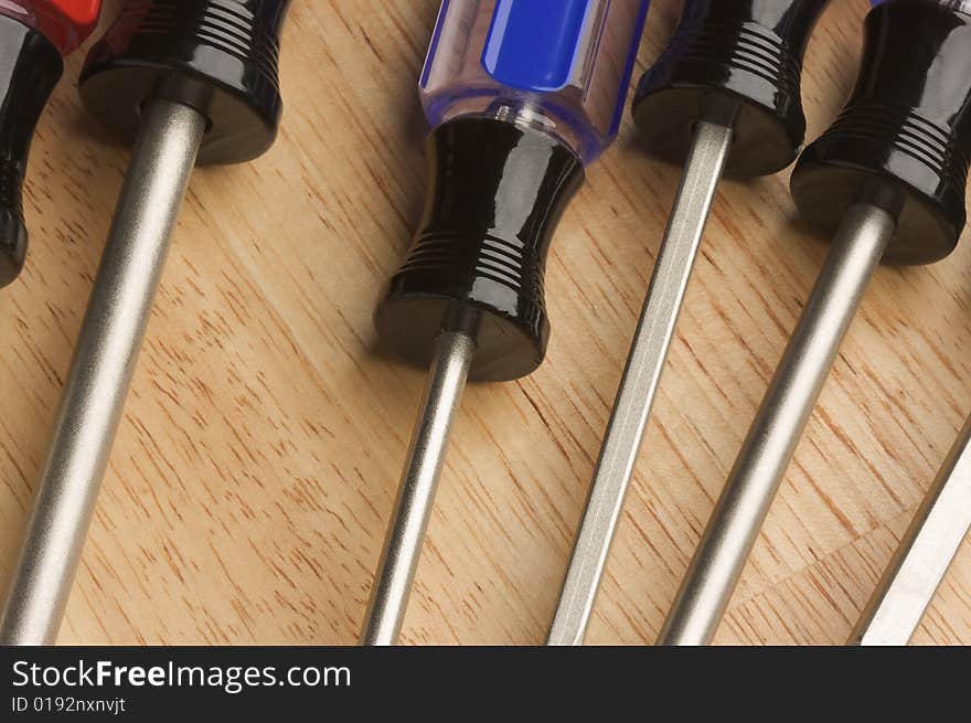 Macro Abstract of Tools on a Wood Background.