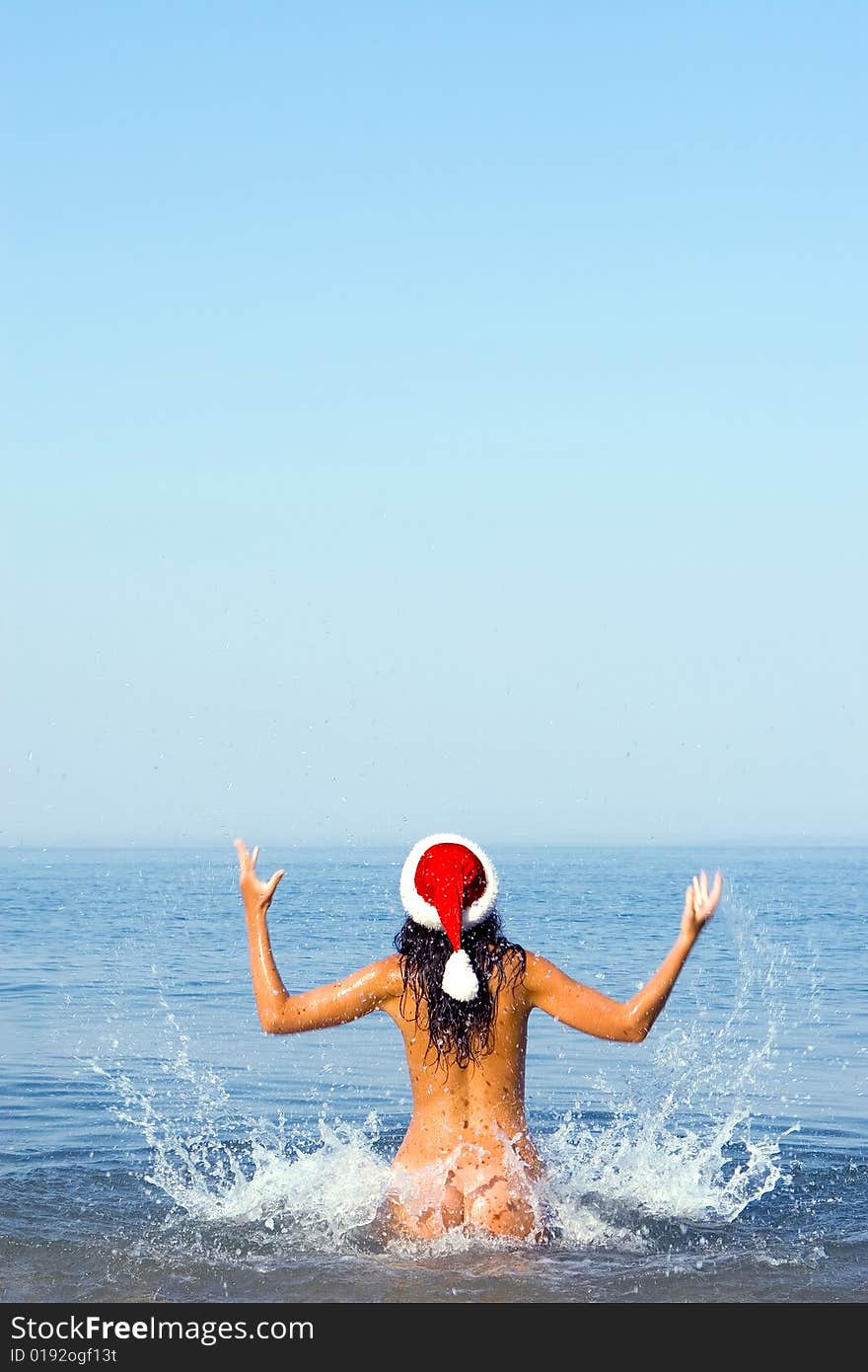 Sexy santa girl in the sea