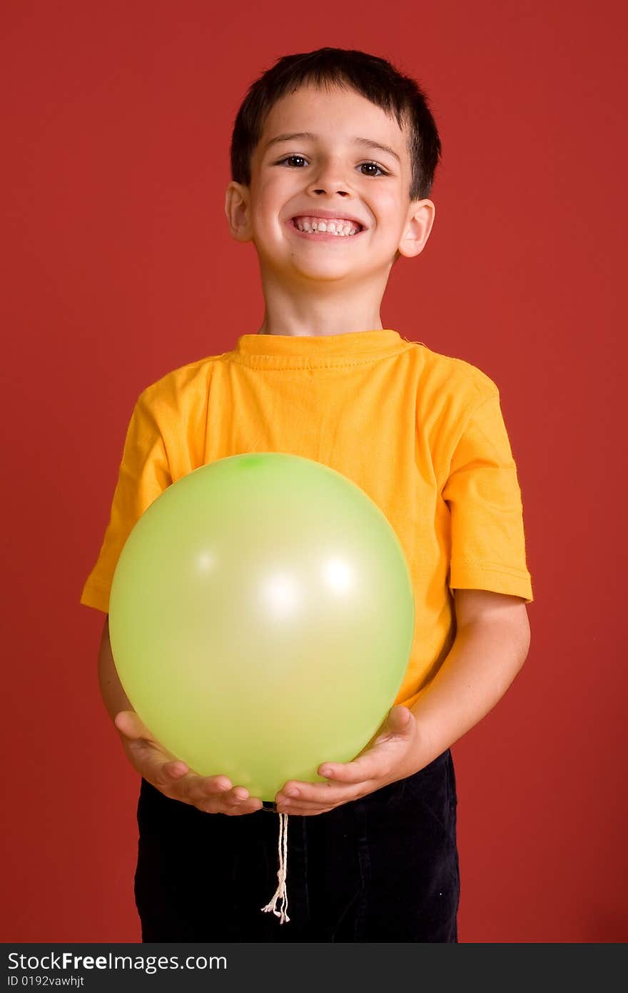 Smiling boy with green ballon. Smiling boy with green ballon