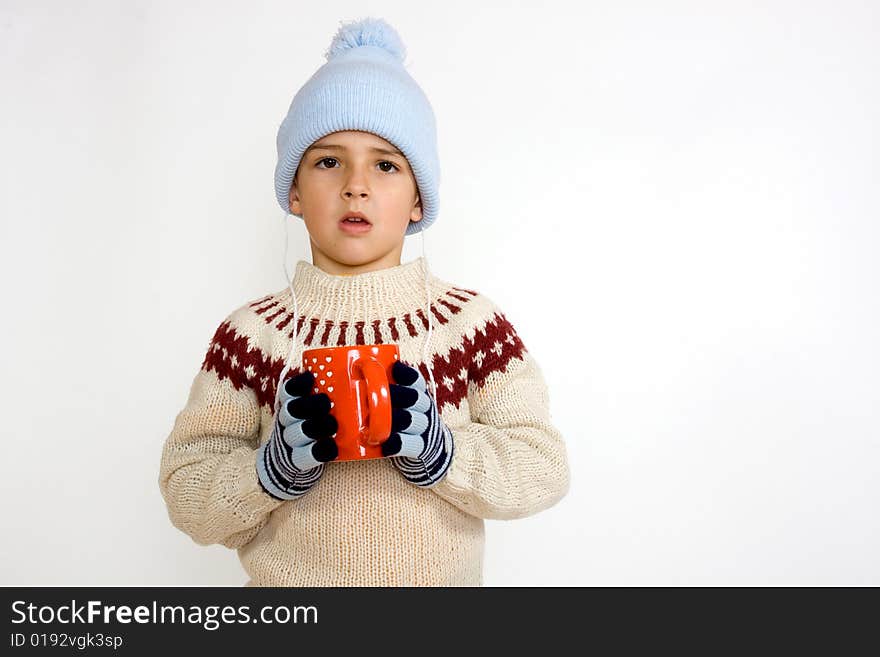 Little boy with cup of hot tea - isolated on white background