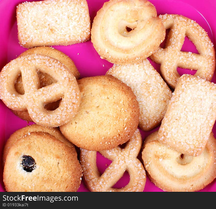 Stack of cookies in pink plate