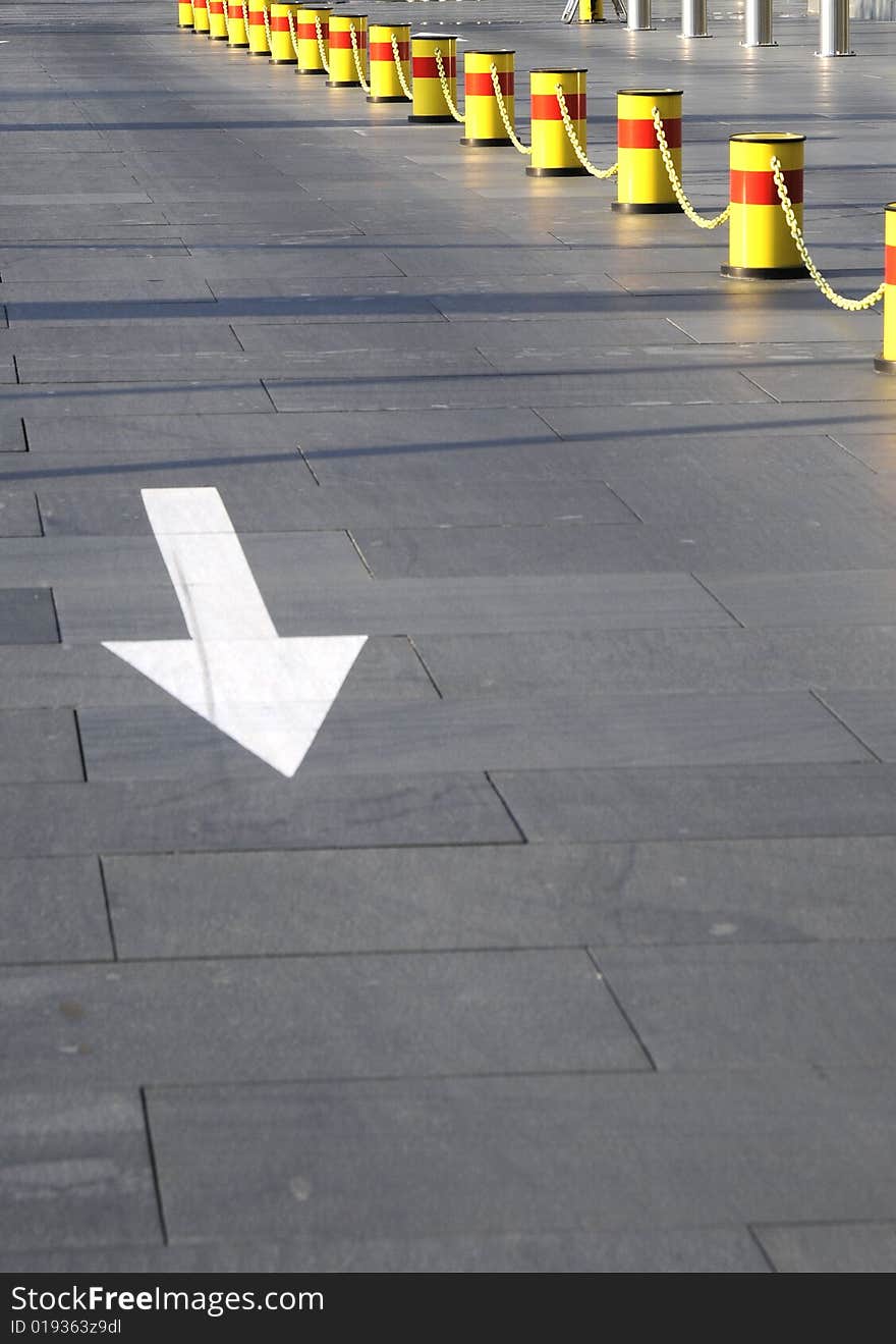 Sign of direction on the road, warning chain and arrow sign