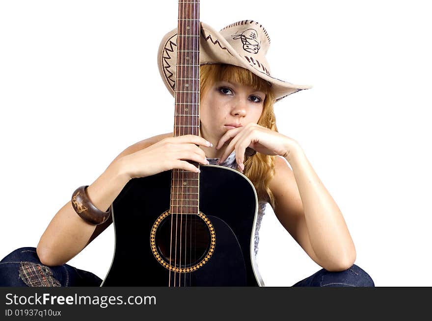 Close up portrait with guitar. Pretty, blonde girl holding guitar, musician in country style.