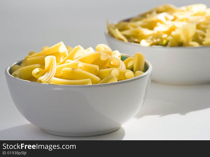 Fresh uncooked raw italian pasta isolated over white