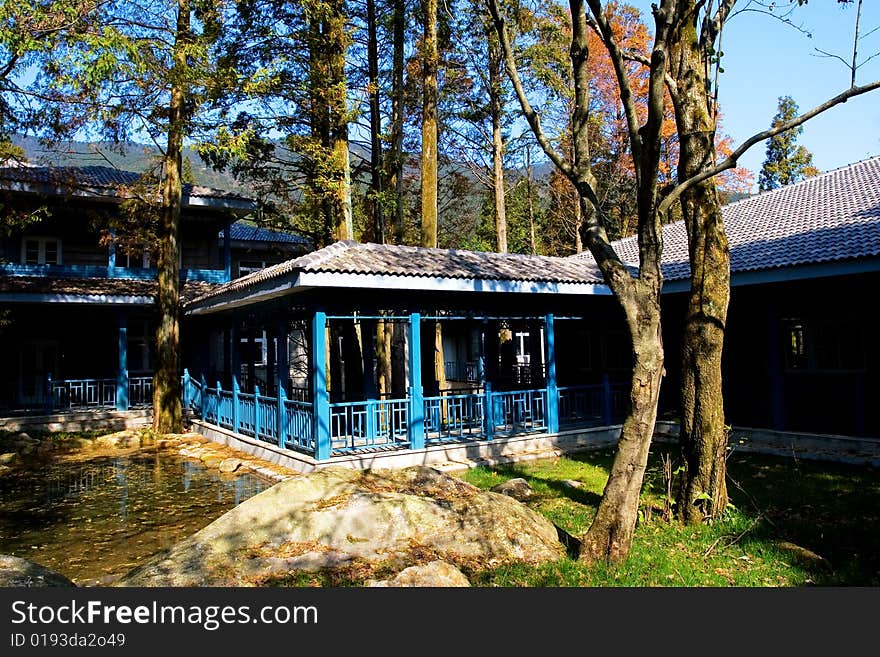 The chinese courtyard in the autumn trees.