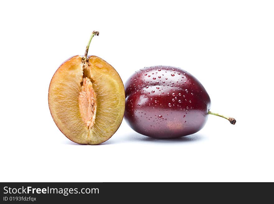 Plum and a half on  white background, isolation