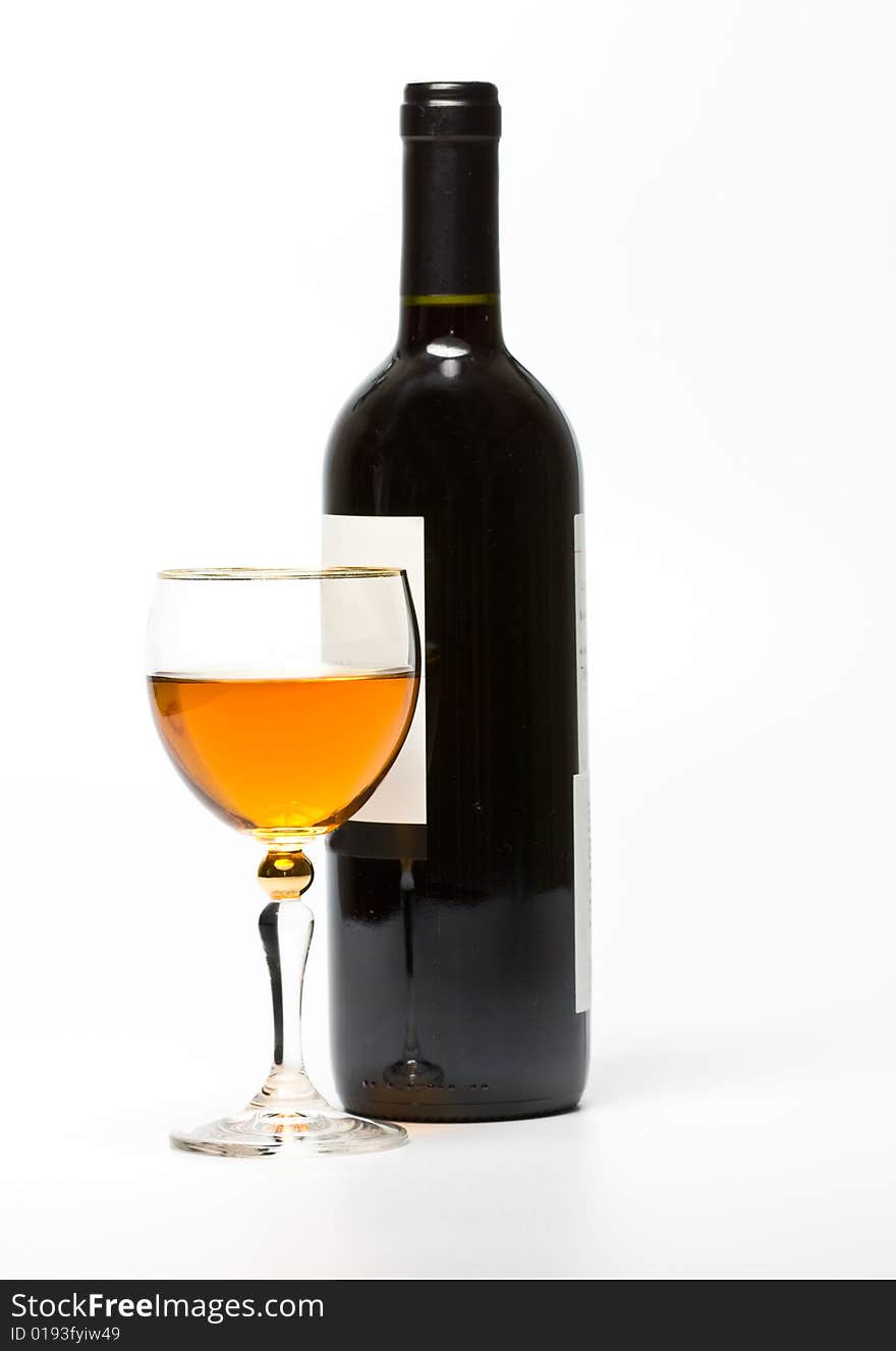 Glass and bottle of wine over white background