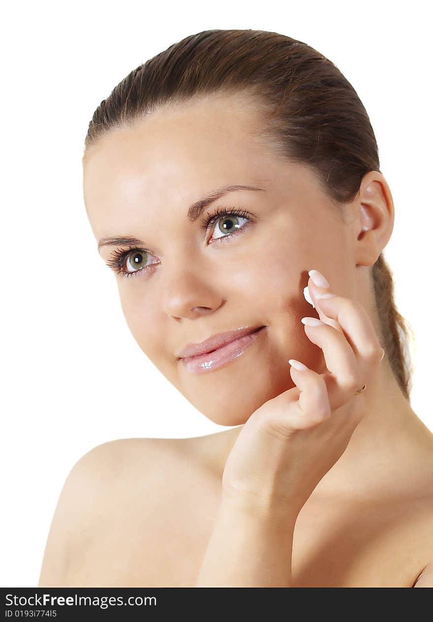 Portrait of young  smiling beautiful woman applying creme. Portrait of young  smiling beautiful woman applying creme