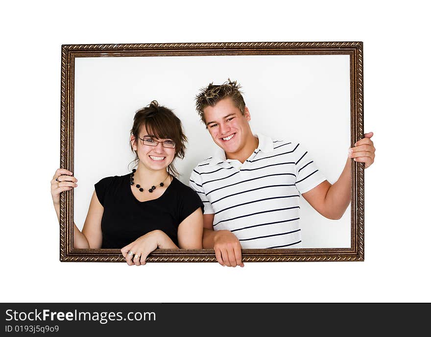 Young smiling couple in a picture frame. Young smiling couple in a picture frame