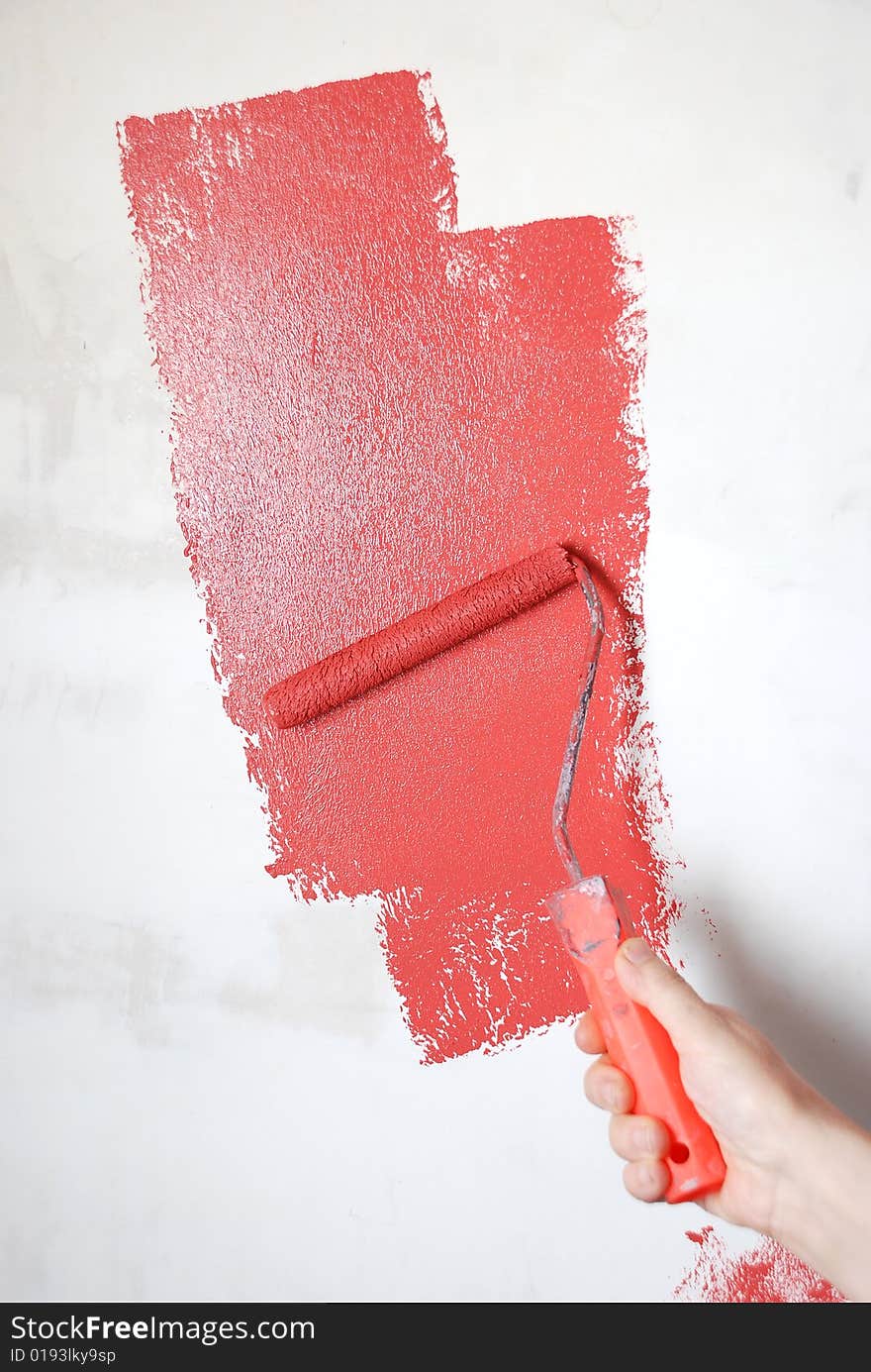 Painting a wall with a roll