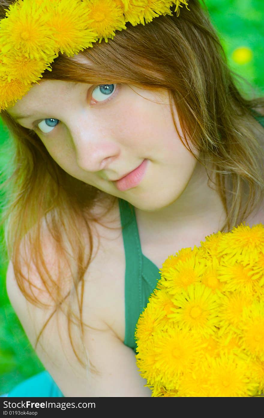 Fine girl with bouquet dandelion