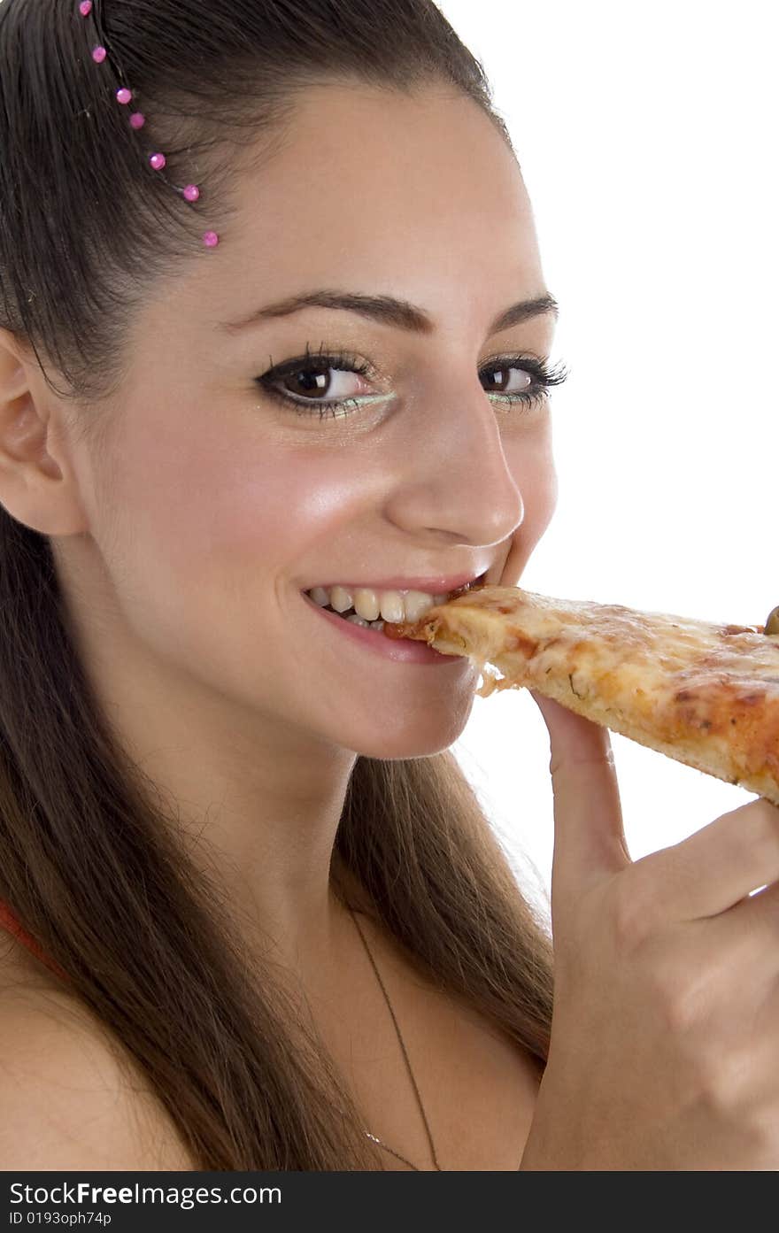 Young girl eating pizza on an isolated white background