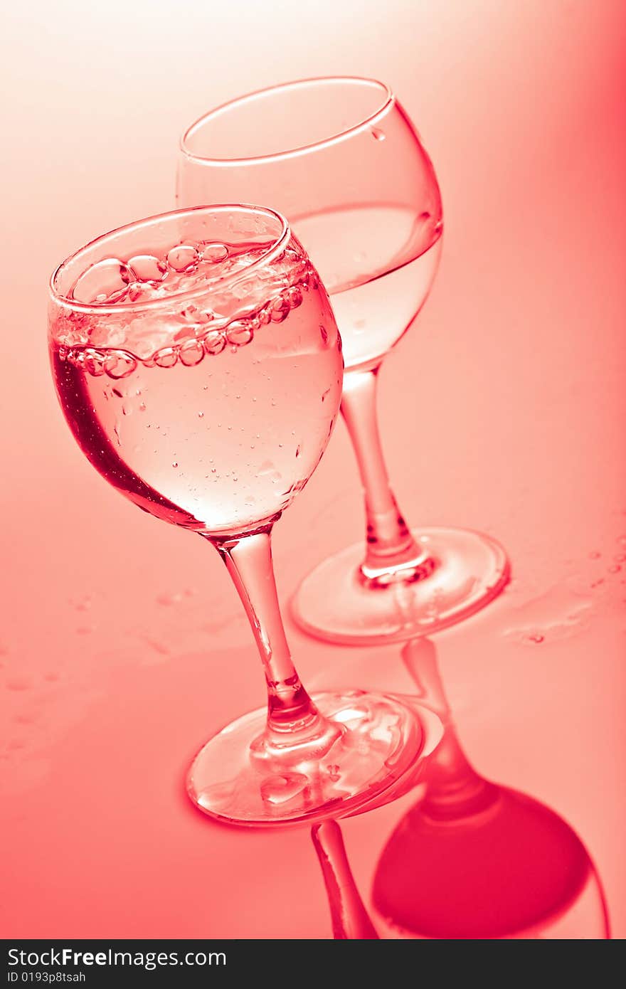 Water in glasses toned pink