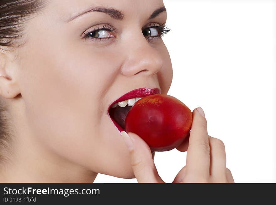 Beautiful girl eats peach