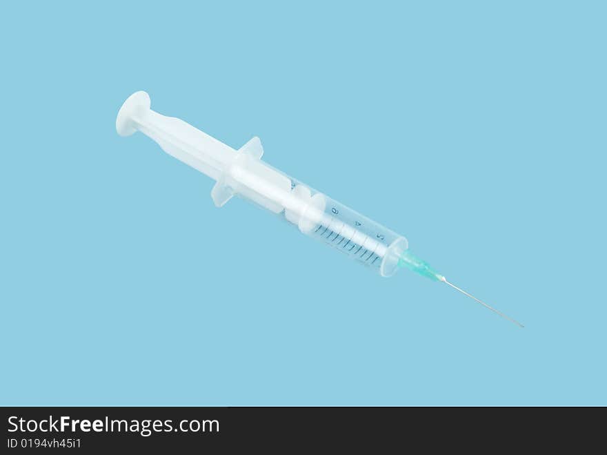 Syringe isolated on blue background