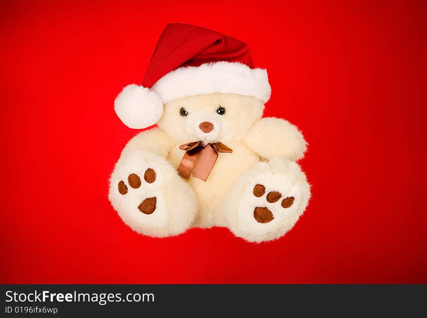 Teddy bear on  red background