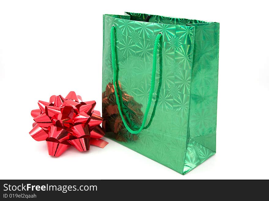 Green package and red bow on isolated. Green package and red bow on isolated