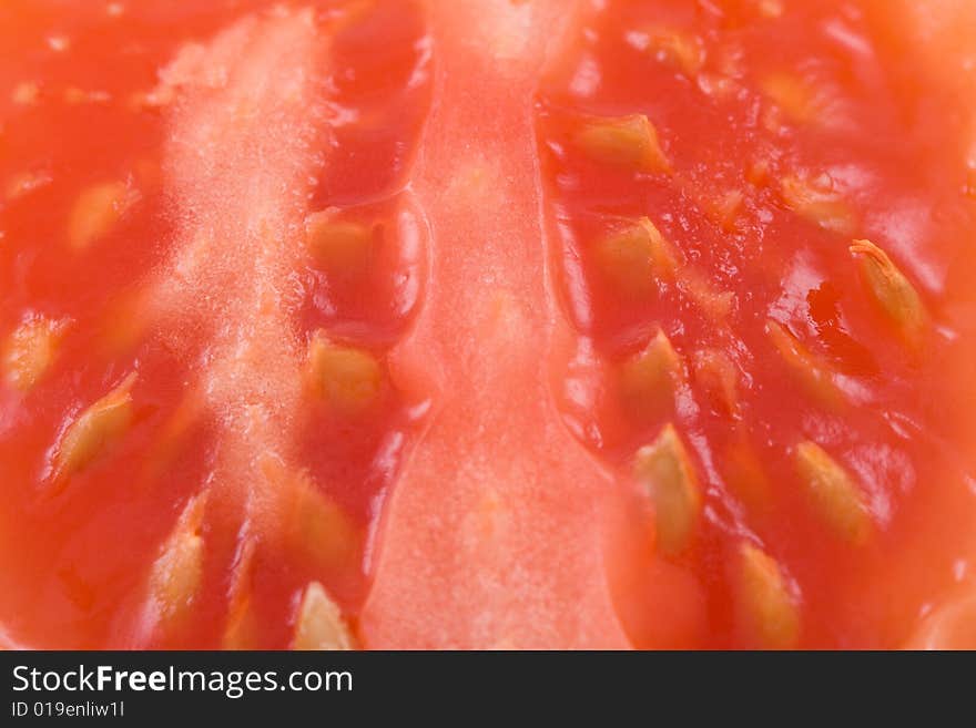 Slices red tomato - macro background .