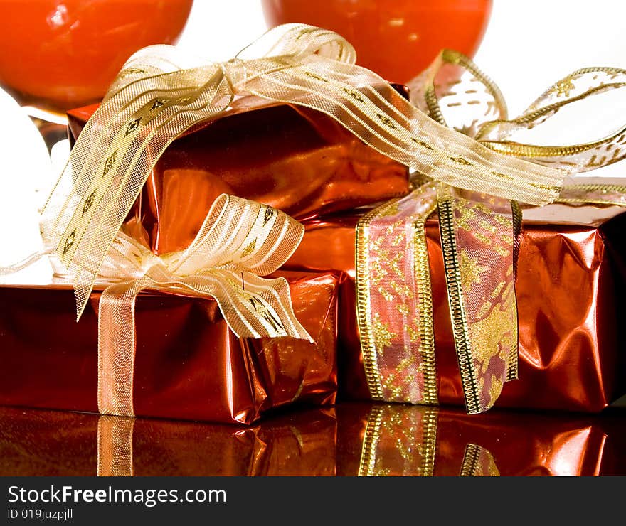 Christmas gifts decorations on reflecting background. Christmas gifts decorations on reflecting background