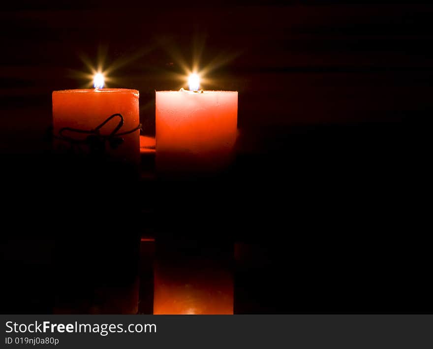 Red candles on dark background