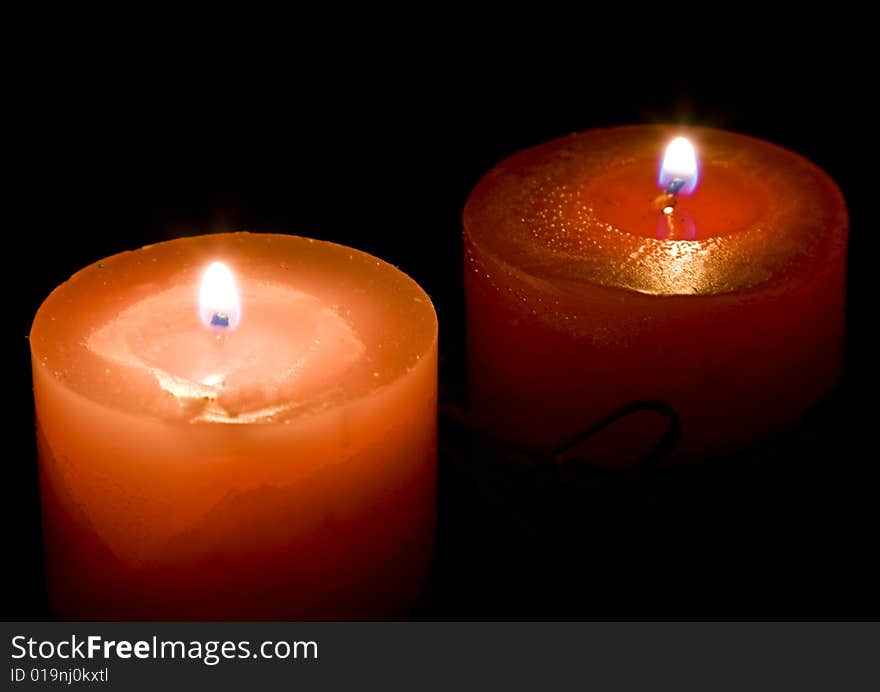 Red candles on dark background