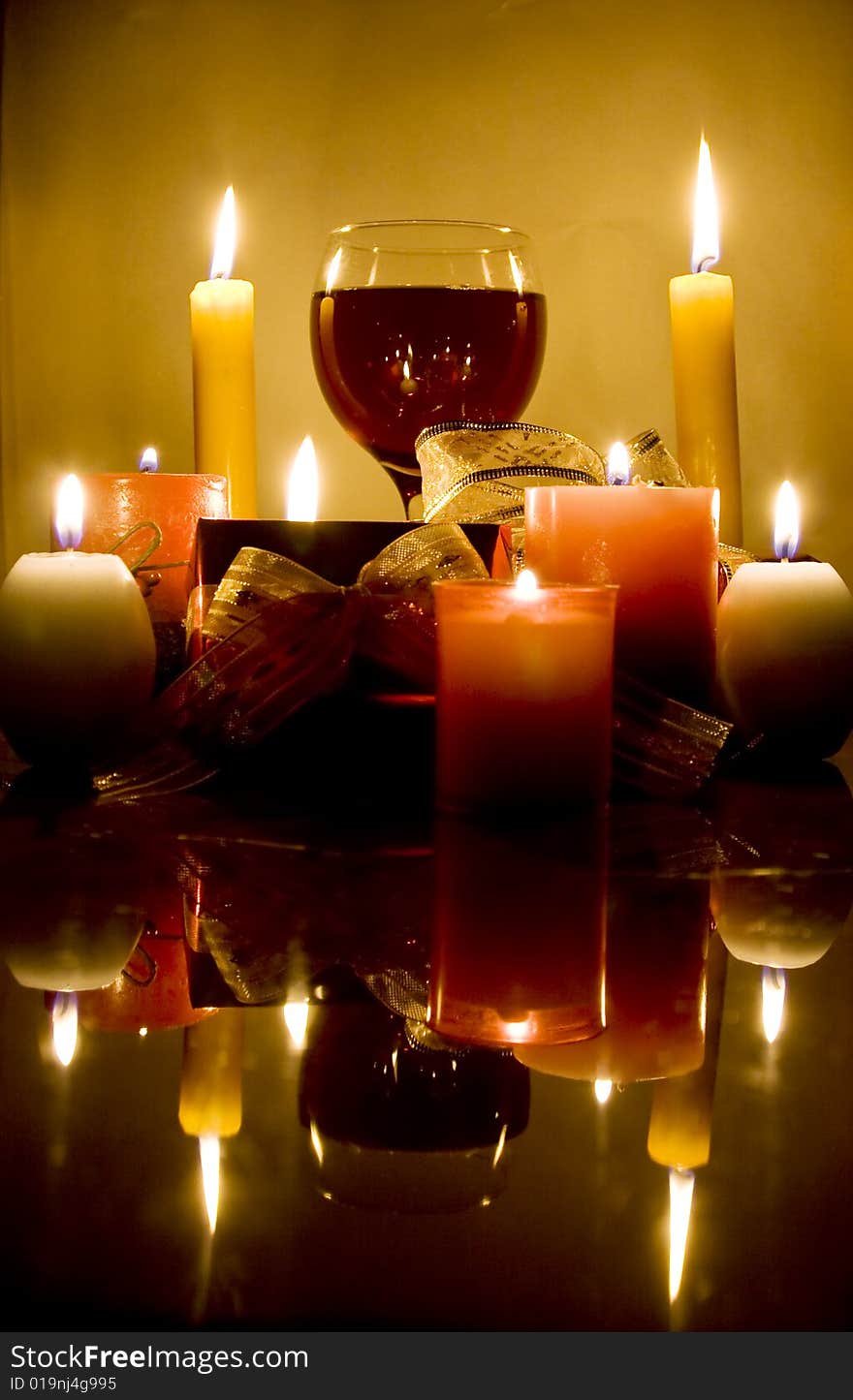 Christmas gifts , candles and red wine. Christmas gifts , candles and red wine