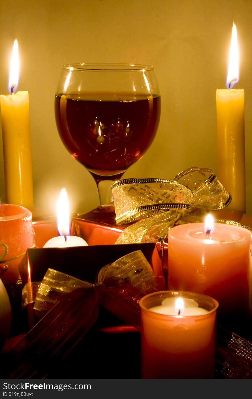 Christmas gifts , candles and red wine. Christmas gifts , candles and red wine