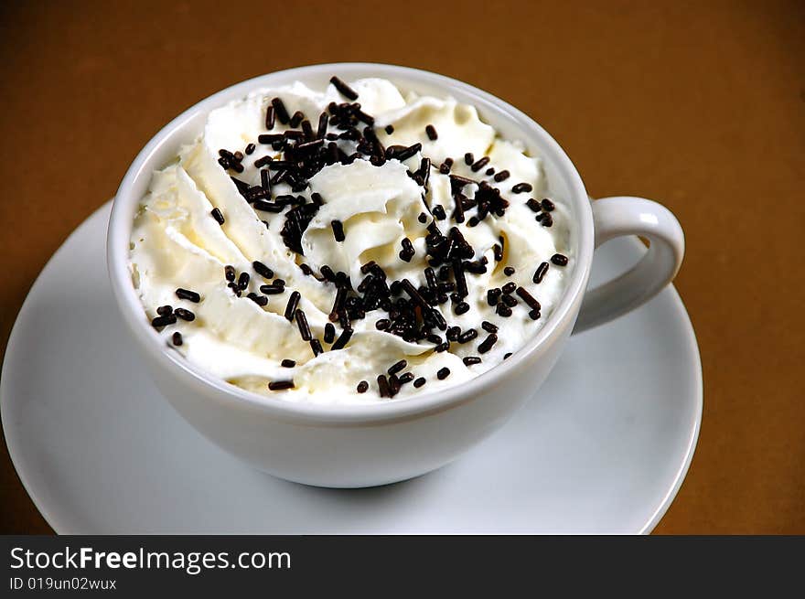 Hot cocoa with whipped cream and chocolate sprinkles