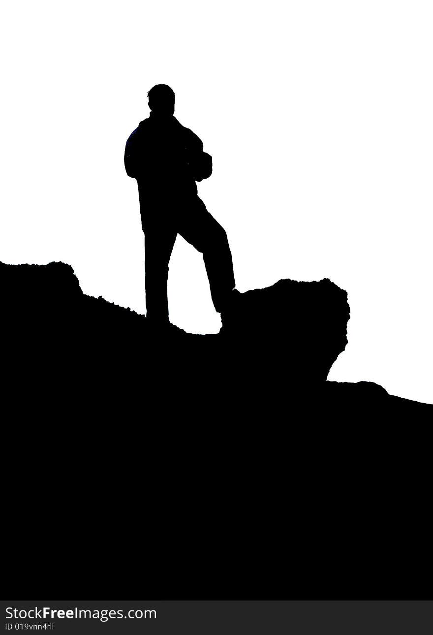 The silhouette of the man which stands on mountain. The silhouette of the man which stands on mountain