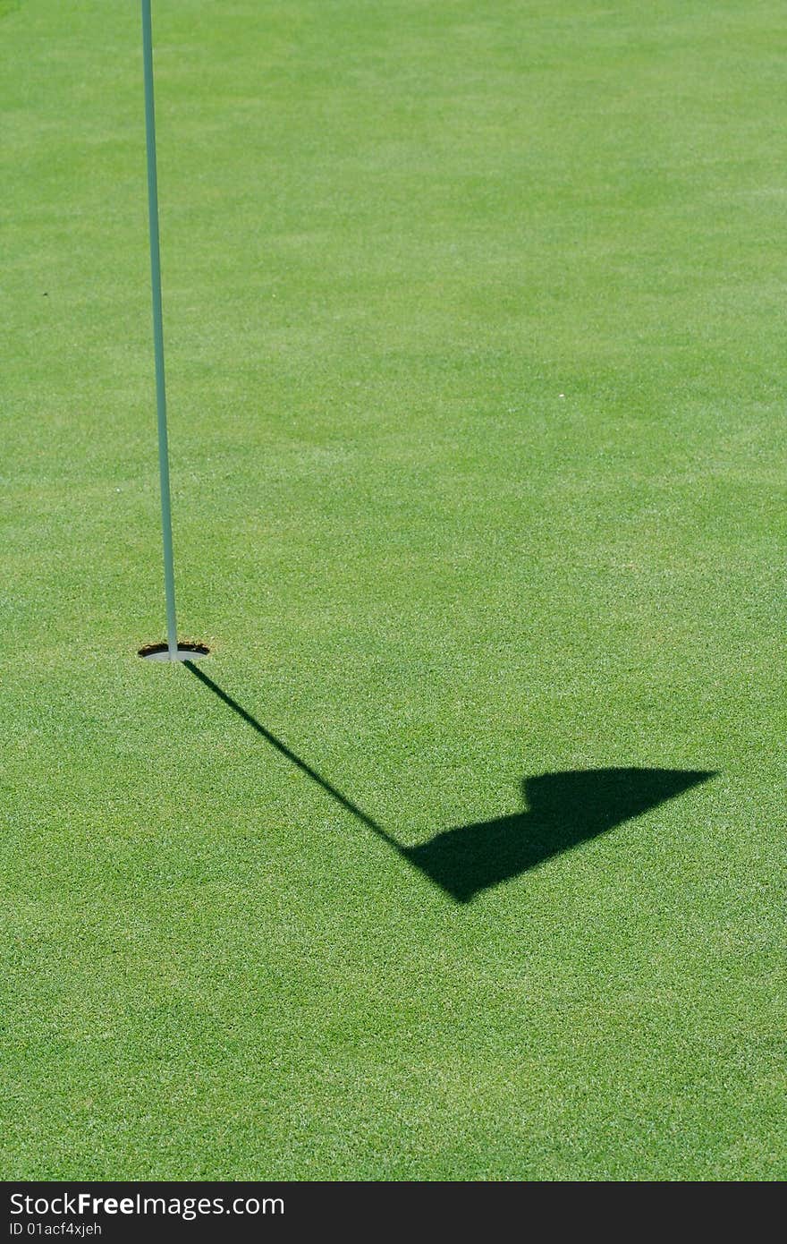 A Golf green flag shadow