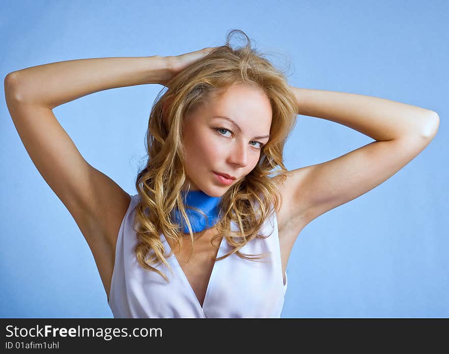 Portrait of a beautiful teen on blue